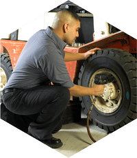 Technician working on a fork wheel